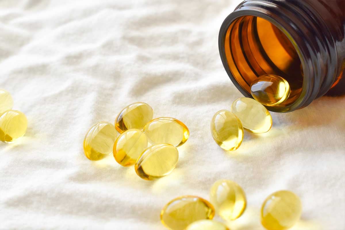 Vitamins spilling out of a container